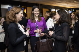 women networking with wine