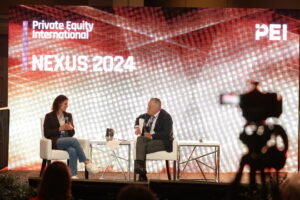 man and woman on stage at NEXUS 2024