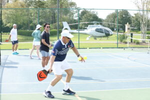 men playing pickleball outside